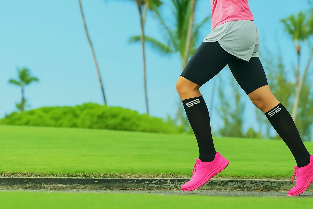 Woman demonstrating the benefits of compression products for recovery by running in compression socks outdoors